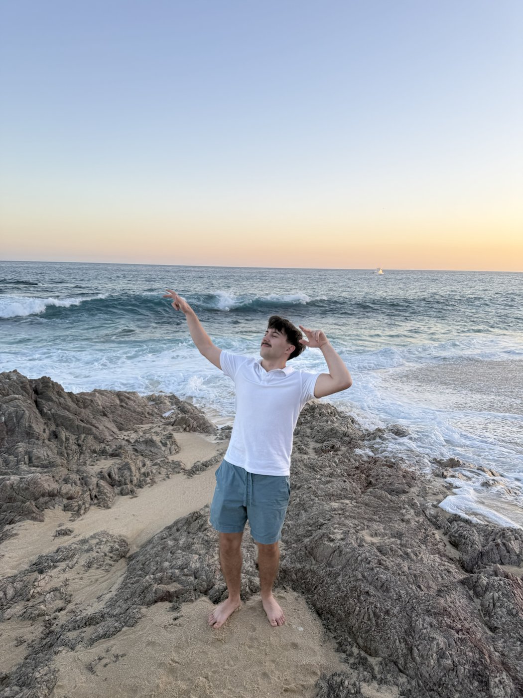 Jayden by the ocean at sunset